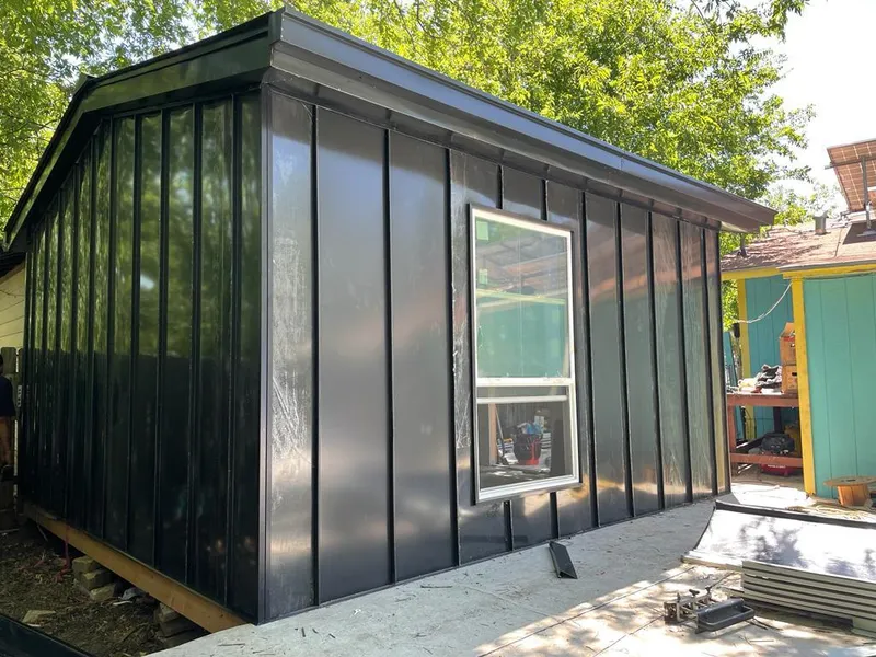 Black standing seam metal wall panels for Roof Inspection in Marilla