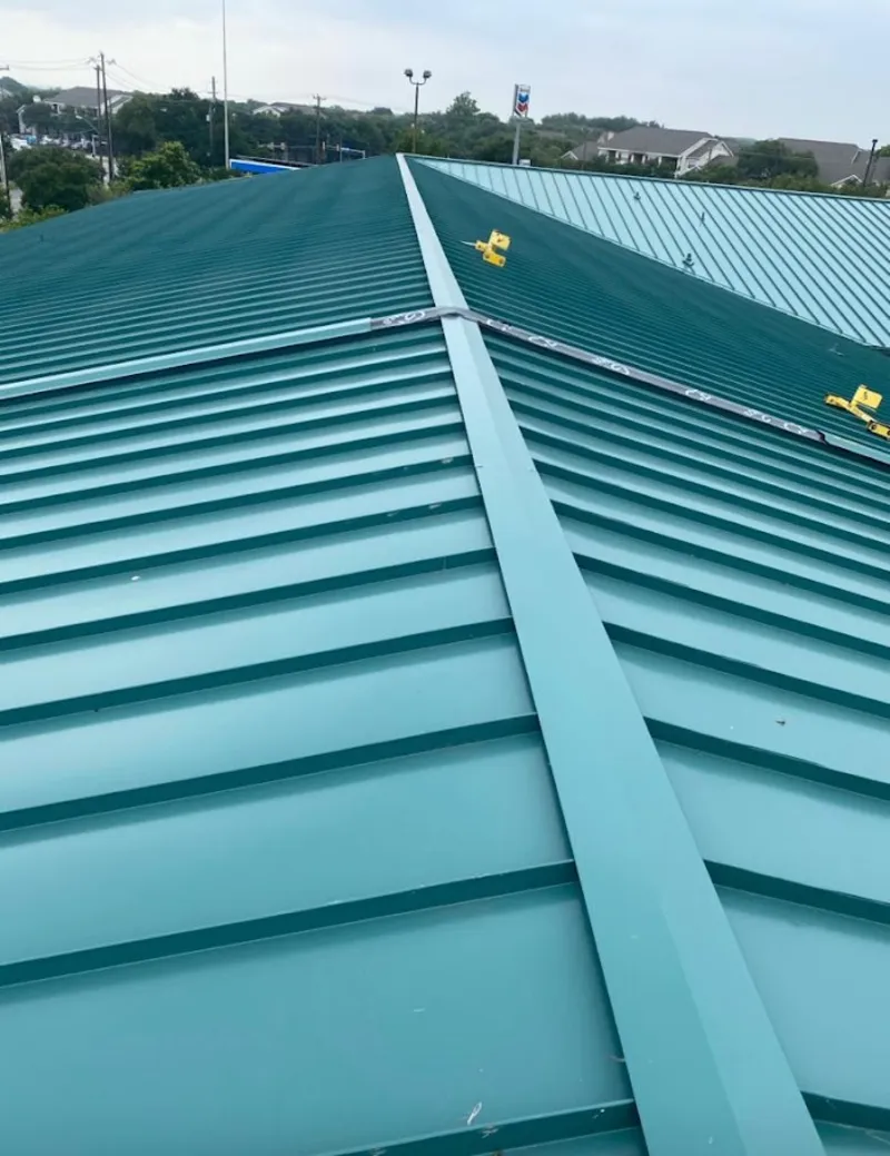 Green commercial metal roof ridge and valley for Metal Roof Repair in Marilla