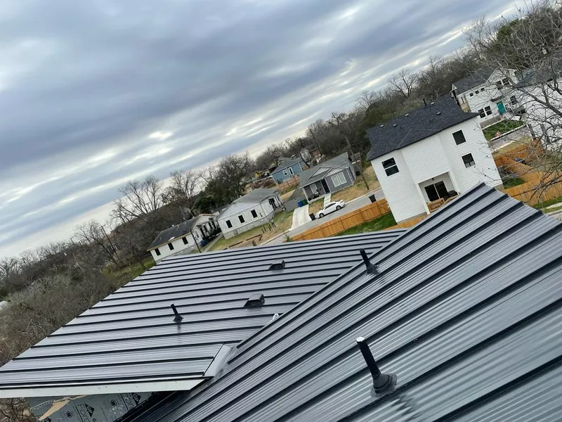 Standing seam metal roof panels with vents for Skylight Repair in Marilla